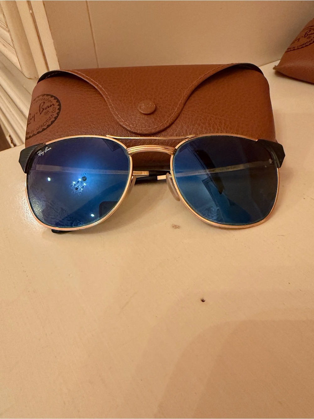 Ray-Ban Rose Gold Metal Temple Sunglasses Arm with Brown Case Visible